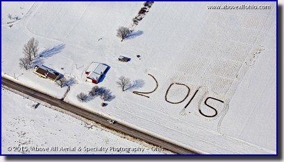 An aerial view of a farmer's field, apparently wishing pilots a happy new year!