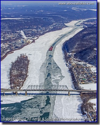 An aerial view of a barge coming down an icy Ohio River in East Liverpool, Ohio.
