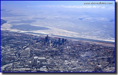 Aerial photo of the Cleveland, Ohio, downtown skyline, surrounding area, and icy Lake Erie in the winter