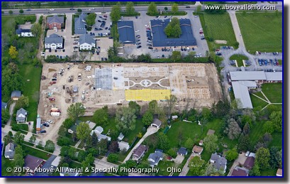 An oblique aerial view showing progress at a construction site in Medina, OH.