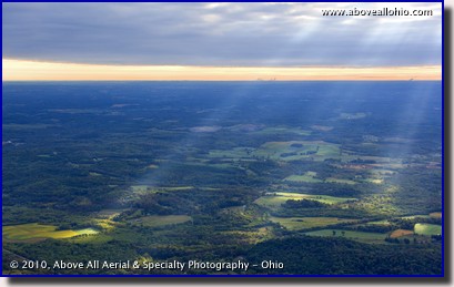Aerial photograph of sunbeams breaking through the clouds early in the morning south of Canton, Ohio